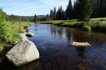 Sumava National Park, crystal clear water in river with boulders, Modrava, Czech Republic