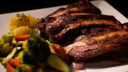 Dishes with roasted meat and vegetables