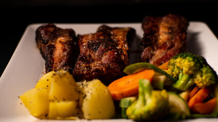 Dishes with roasted meat and vegetables
