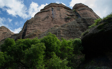 Geology. View of the forest, cliff and rocky mountains in a summer sunny day. 