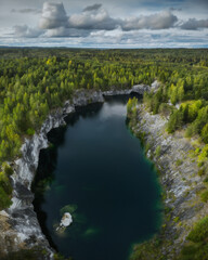 Naklejka na ściany i meble Aerial drone view to Marble canyon in Ruskeala Nature Reserve in Republic of Karelia, North Russia