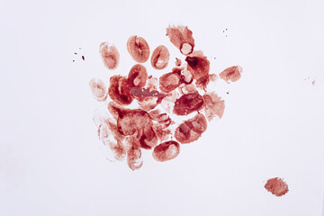 Blood splatter and fingerprints isolated on a white background.