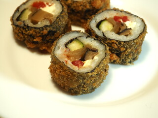 Sushi roll with mushrooms, tomatoes and cucumbers