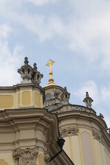 Fototapeta na wymiar orthodox church, details and ornaments, golden cross and sky