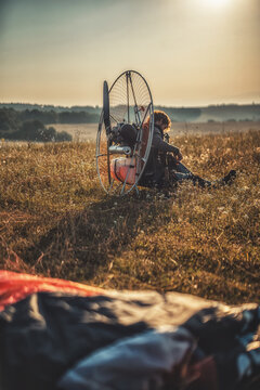 Paragliding in the mountains, paraglider on the ground.