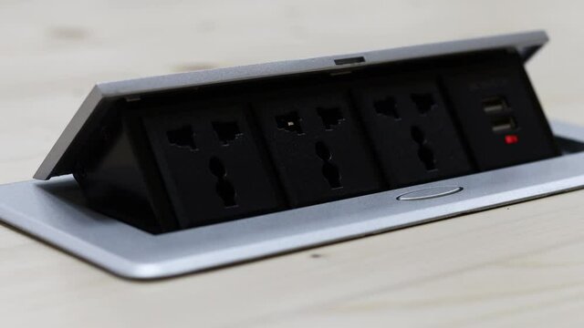 Close up young man's hand pressing button, Man's hand held the plug into the outlet And unplugging after use.