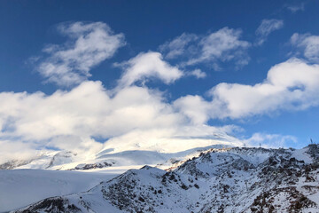 elbrus peaks hidden by the white clouds, winter shot. The highest point in europe
