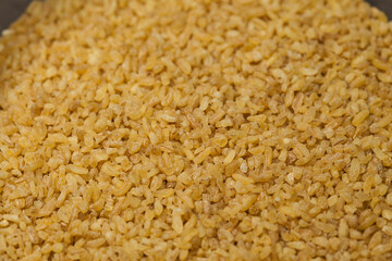 Close up bulgur grains background.