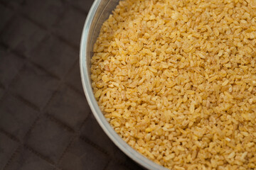 Close up bulgur grains background.