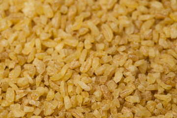 Close up bulgur grains background.