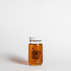 glass jar of sweet natural honey
