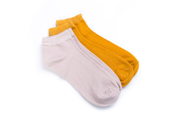 two pairs of colored short socks on a white background, top view