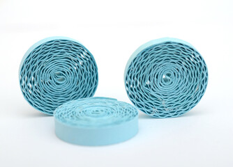 three blue round quilling paper shapes