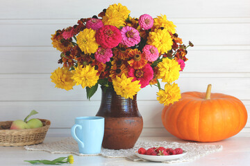 bouquet of garden flowers, pumpkin and raspberry.