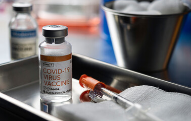Coronavirus covid-19 experimental vaccine in a laboratory, conceptual image