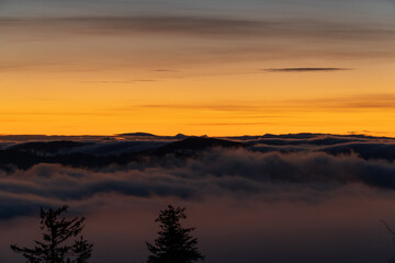 Early dawn. The rising of the sun above the clouds. Expectation of the sun. Beskydy , Czech Republic.