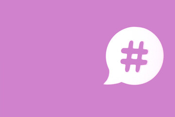 Purple background with hashtag in bubble speech.