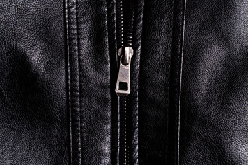 Metal zipper close-up on a leather jacket.