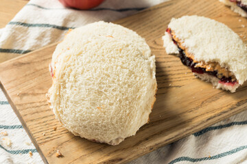 Fototapeta na wymiar Healthy Homemade Crustless Peanut Butter Jelly Sandwich