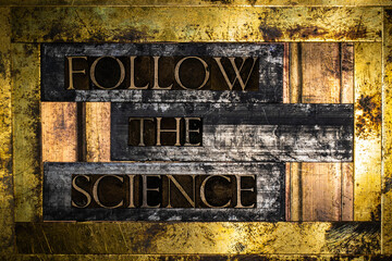 Follow The Science text on grunge lead with textured bronze and copper background