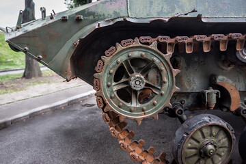 Fototapeta na wymiar rusty caterpillar of a military machine
