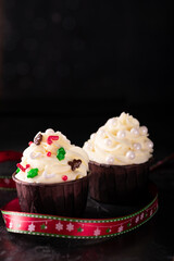 Cupcakes with vanilla cream and decorations on New Year's Eve