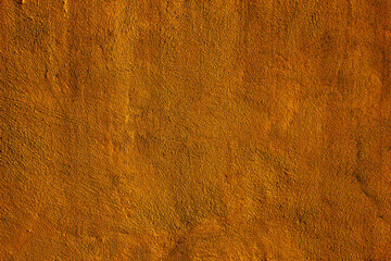 Copper colored wall texture background with textures of different shades of copper or bronze