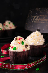 Cupcakes with vanilla cream and decorations on New Year's Eve