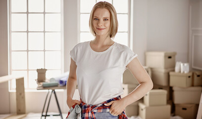 Woman in room is ready to start repairs