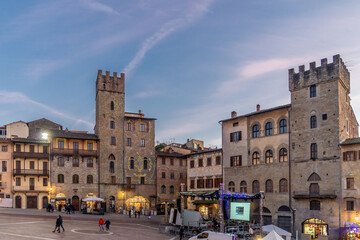 Fototapeta na wymiar Old Building in the Main Square of Arezzo City during the Christmas time, Piazza Grande in the evening, Tuscany, Italy