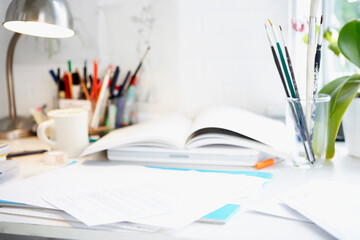 Desk With Books; Papers And Brushes