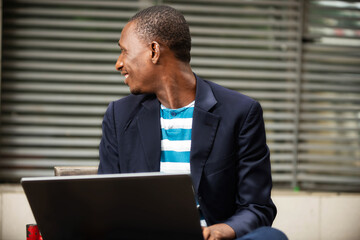 handsome man holding a laptop