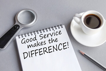 good servise makes the difference, text on white paper on gray background near coffee cup