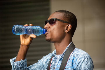 young tourist drinking mineral water