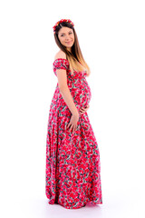 Portrait of beautiful young pregnant woman in dress on white background. Isolate on a white background.