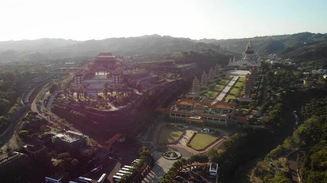 Aerial drone sunset view of Fo Guang Shan Buddha Museum in Kaohsiung, Taiwan.
Mid angle, parallax movement, HD.