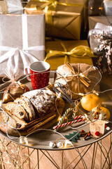 New Year's table with treats and sweet gifts. tree and gifts