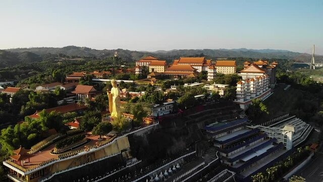 Aerial drone sunset view of Fo Guang Shan Buddha Museum in Kaohsiung, Taiwan.
Mid angle, parallax movement, HD.