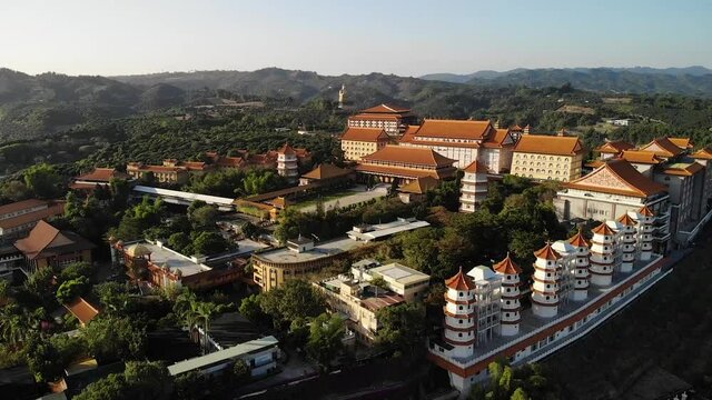 Aerial drone sunset view of Fo Guang Shan Buddha Museum in Kaohsiung, Taiwan.
Low angle, traveling and tilt movements, HD.