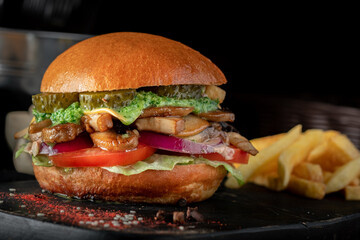 Vegetarian Burger with mushrooms, fresh vegetables and guacamole sauce