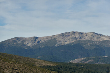 Fototapeta na wymiar Panoramic views of the Sierra de Guadarrama National Park from the Cuerda Larga path. Madrid's community. Spain