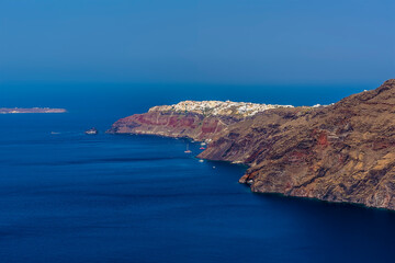 A view from the path on the Caldera rim in Santorini towards the northern tip in summertime