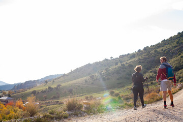 Obraz premium One couple hiking in the mountains