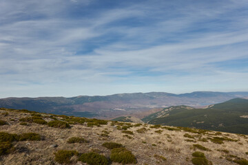 Fototapeta na wymiar Panoramic views of the Sierra de Guadarrama National Park from the Cuerda Larga path. Madrid's community. Spain