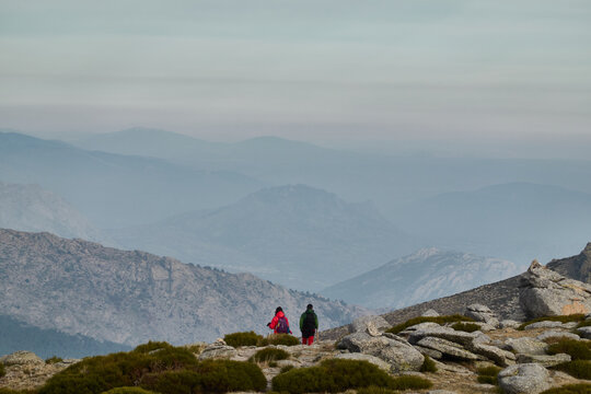 Mountaineers walking along the Cuerda Larga path in the Sierra de Guadarrama National Park. Madrid's community. Spain