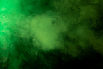 Green smoke texture on black background