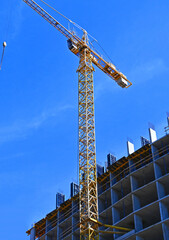 Crane and highrise construction site