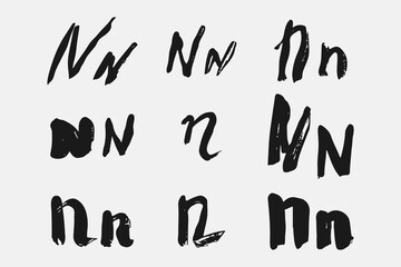 Letter N written by hand. Black letter N written in grunge calligraphy. Different versions of the font are hand-drawn in a careless style. Vector eps illustration.