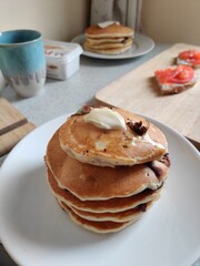 Breakfast: fluffy pancakes with chocolate and butter