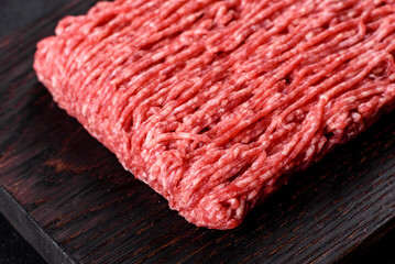 Fresh raw beef mince on a dark background
